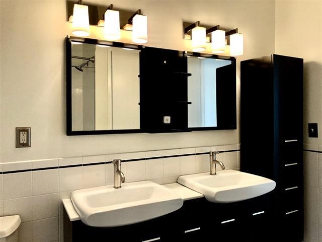 1500 Washington Street, Unit 8I Hoboken, NJ 07030 - Photo 9 of 21 a bathroom with a sink and a mirror