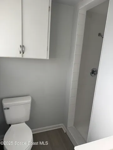 a bathroom with a toilet and a sink