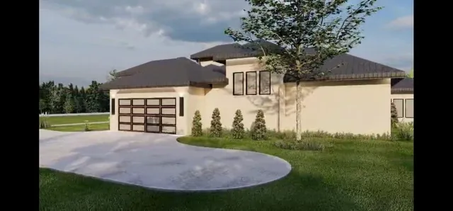 a view of a house with backyard and garden