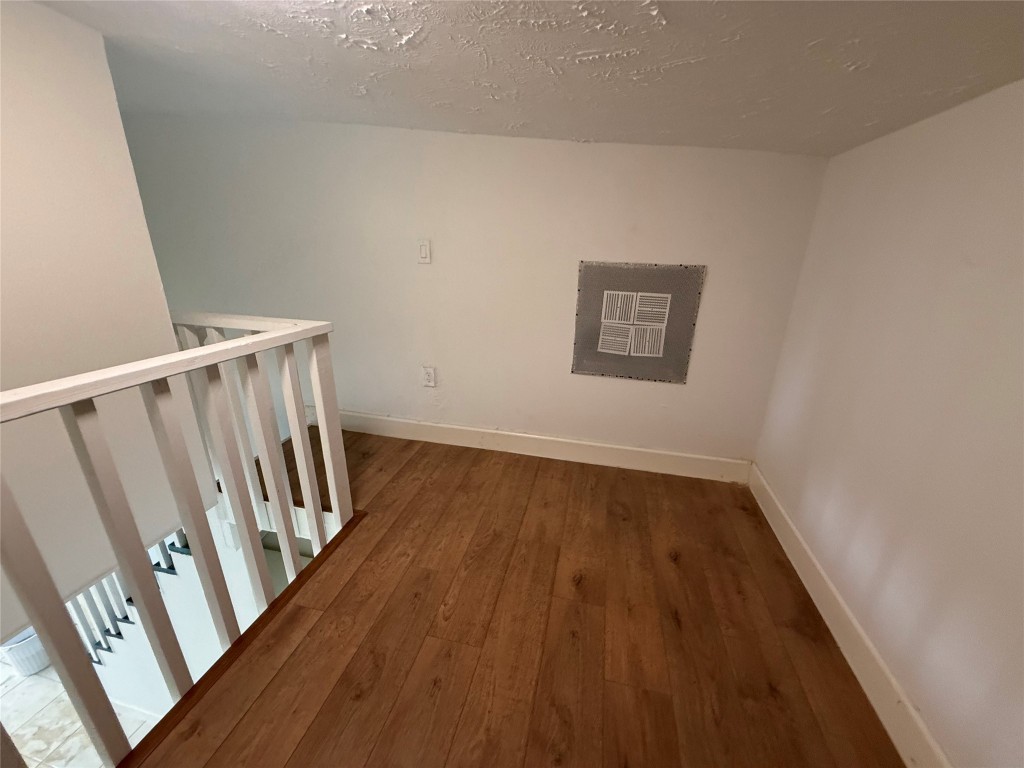 5914 Cullen Boulevard Houston, TX 77021 - Photo 12 of 16 a view of an empty room with wooden floor