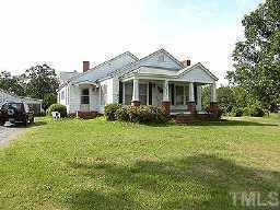3033 Cheek Road Durham, NC 27704 - Photo 1 of 1 a front view of a house with garden