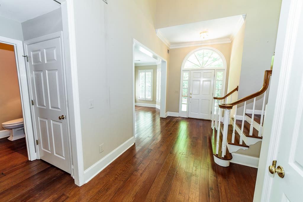 707 Double Churches Road Columbus, GA 31904 - Photo 14 of 59 View of front door, foyer, curved staircase.