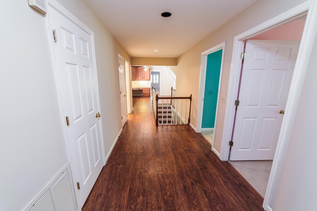 707 Double Churches Road Columbus, GA 31904 - Photo 40 of 59 Upstairs hallway opens to study beyond.