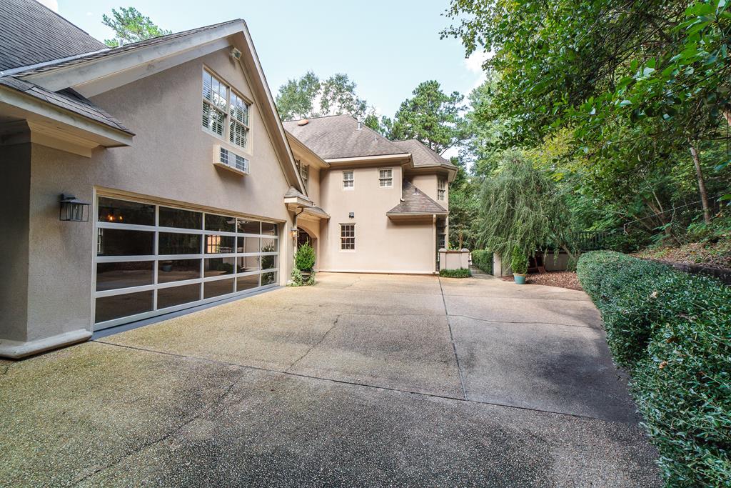 707 Double Churches Road Columbus, GA 31904 - Photo 7 of 59 Parking behind garage w landscaping & pool beyond