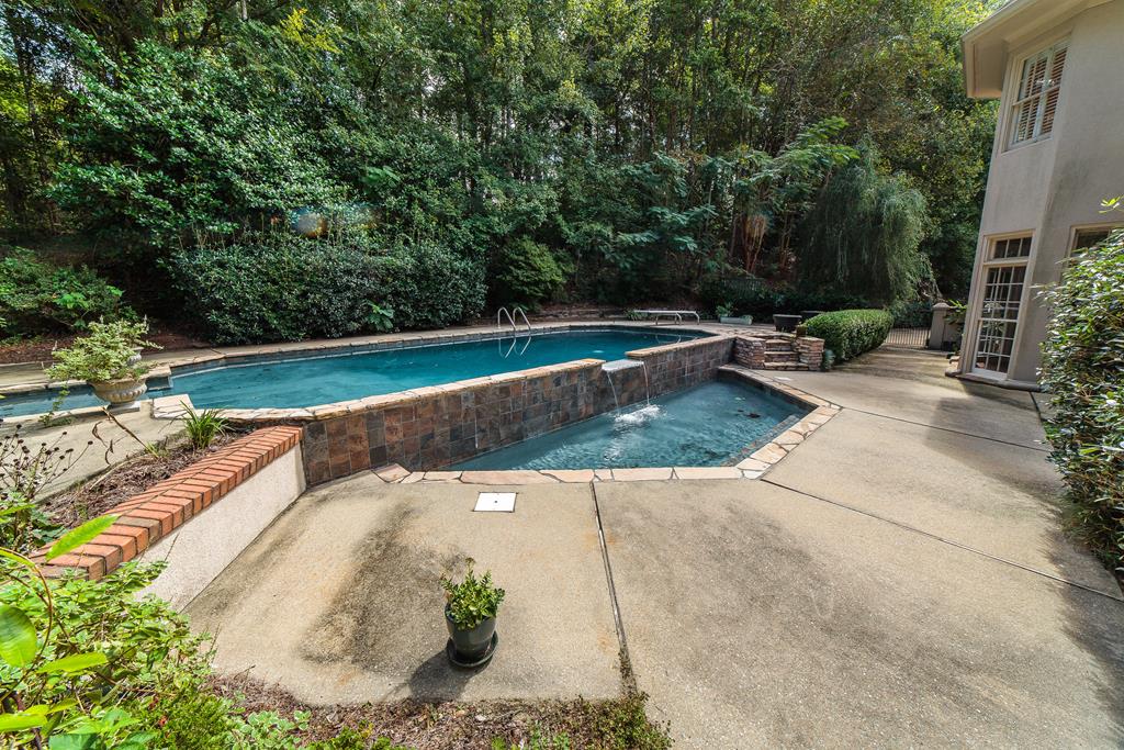 707 Double Churches Road Columbus, GA 31904 - Photo 9 of 59 Beautiful waterfall accent on pool.
