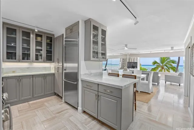 a kitchen with stainless steel appliances granite countertop a stove and a sink