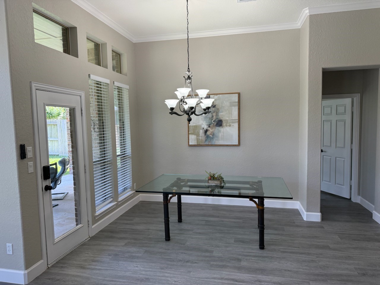 7218 Spring Meadow Lane Katy, TX 77494 - Photo 11 of 30 a view of a room with wooden floor staircase and a chandelier