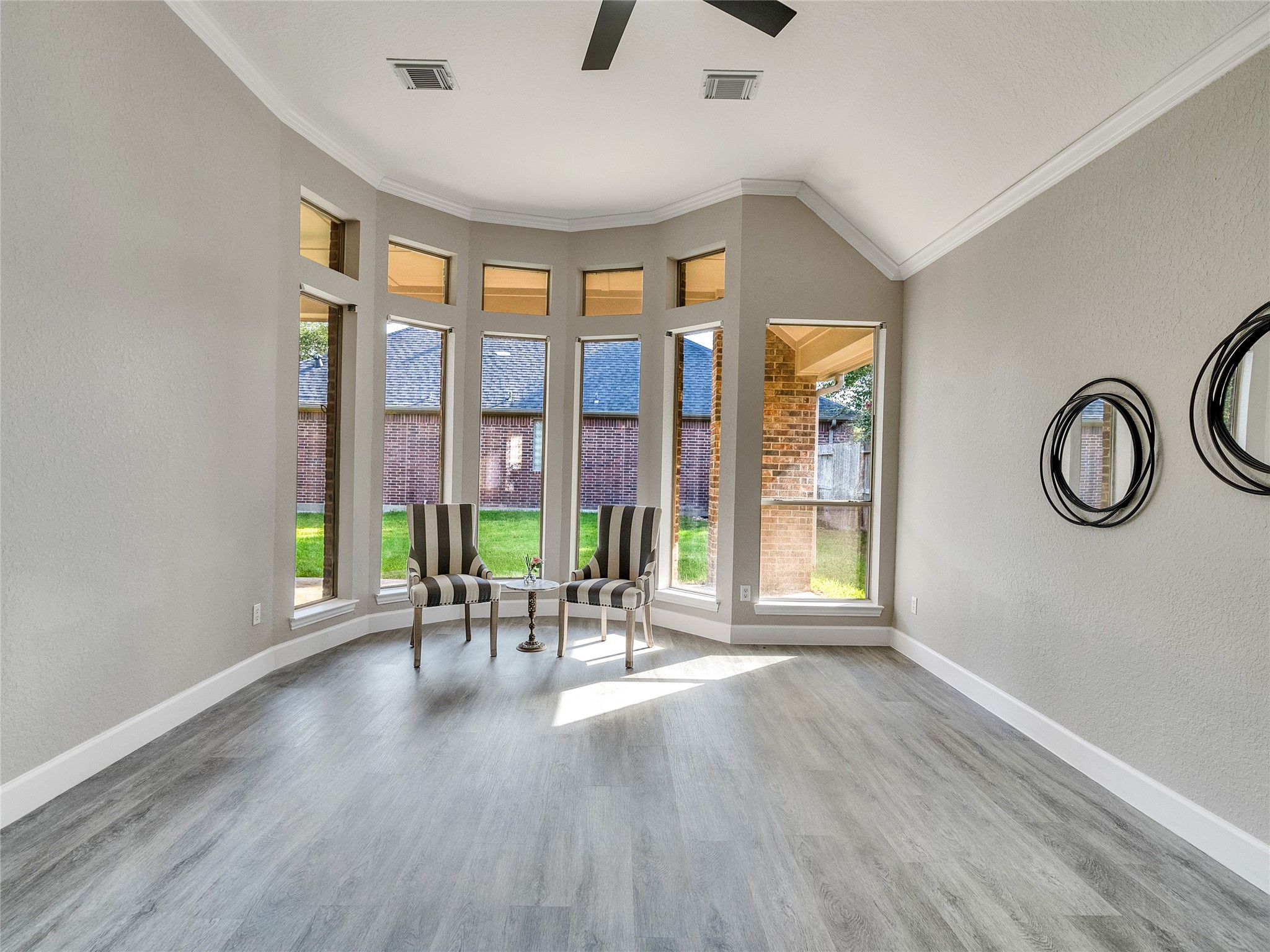 7218 Spring Meadow Lane Katy, TX 77494 - Photo 17 of 30 a view of a livingroom with furniture wooden floor staircase and windows