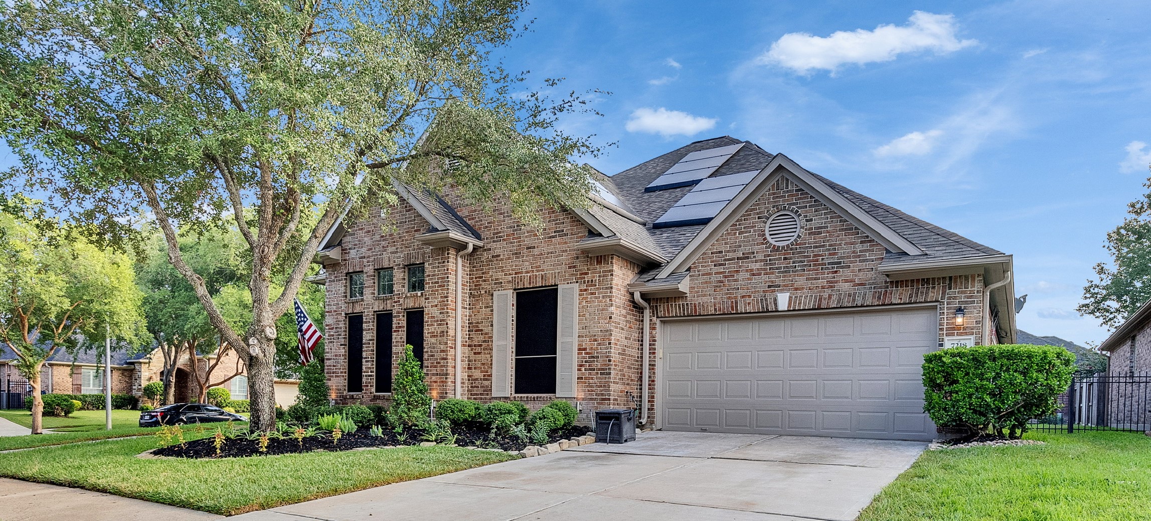 7218 Spring Meadow Lane Katy, TX 77494 - Photo 2 of 30 front view of a house with a yard