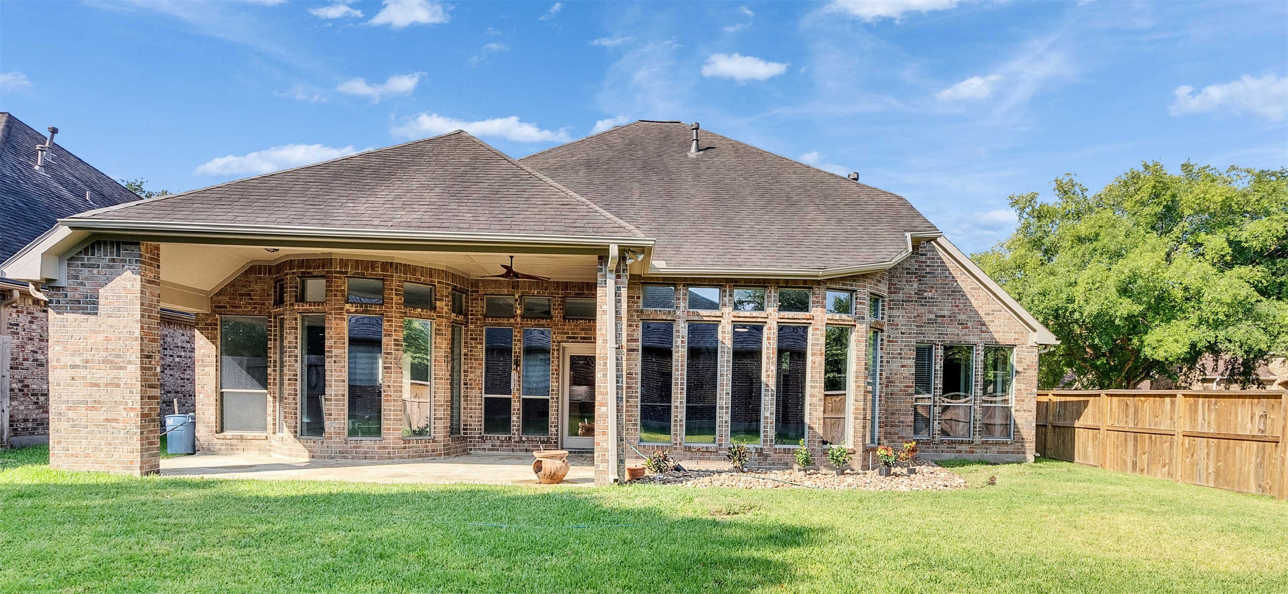 7218 Spring Meadow Lane Katy, TX 77494 - Photo 25 of 30 a front view of house with yard and outdoor seating