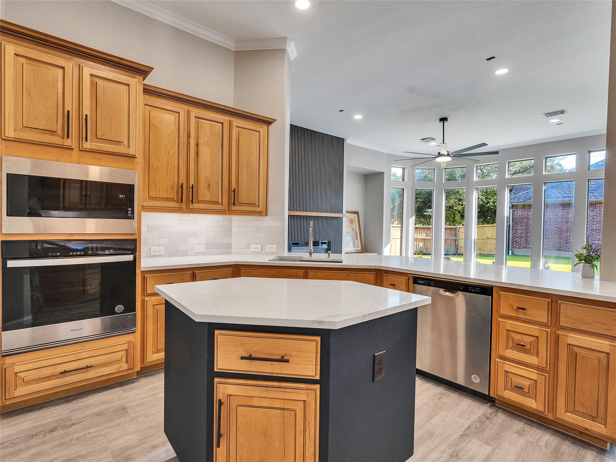 7218 Spring Meadow Lane Katy, TX 77494 - Photo 8 of 30 a kitchen with wooden cabinets and a stove top oven