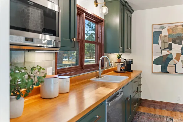 a kitchen with a sink and a microwave