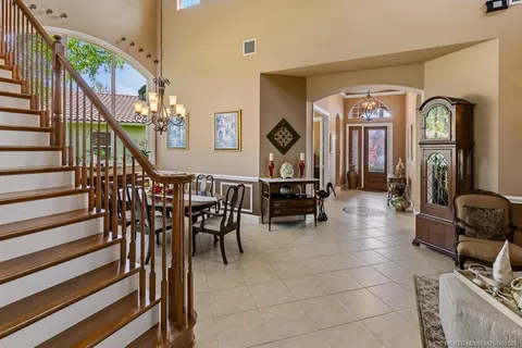 a view of a patio with table and chairs and potted plants