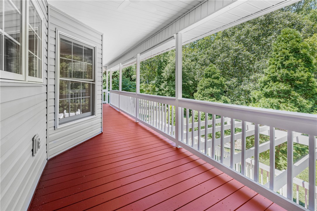 429 Burns Mill Road West Union, SC 29696 - Photo 33 of 49 Enjoy quiet mornings and relaxing evenings on this charming covered porch overlooking a verdant landscape.