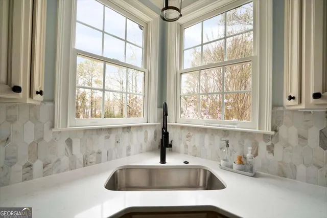 a living room with furniture fireplace and a flat screen tv