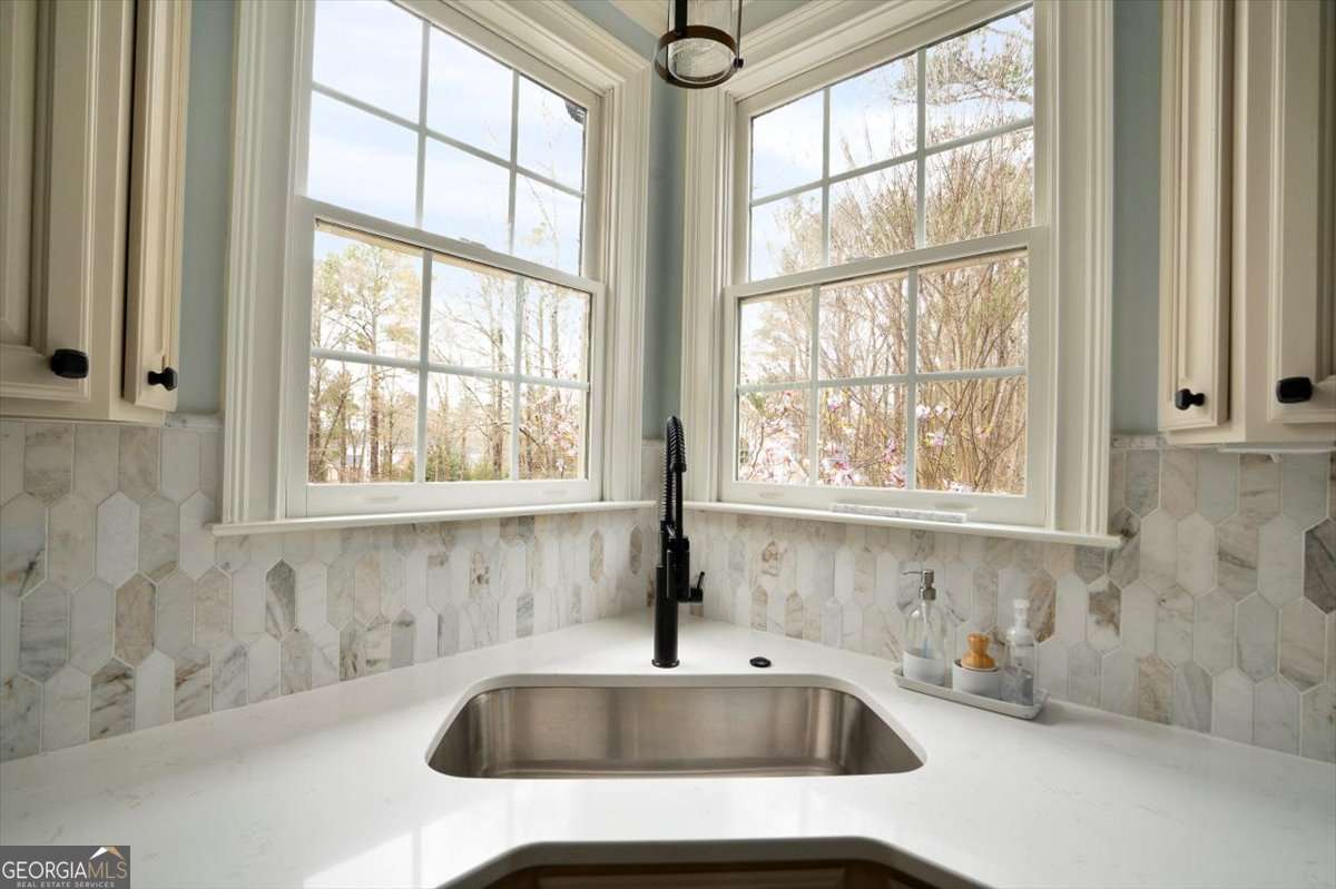 1070 Lexington Court Bishop, GA 30621 - Photo 16 of 67 a bathroom with sink and window
