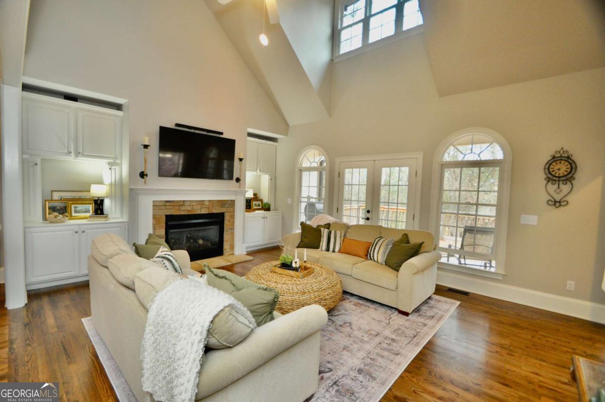 1070 Lexington Court Bishop, GA 30621 - Photo 21 of 67 a living room with fireplace furniture and a flat screen tv