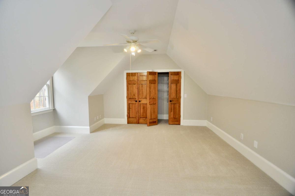 1070 Lexington Court Bishop, GA 30621 - Photo 37 of 67 an empty room with windows and cabinet