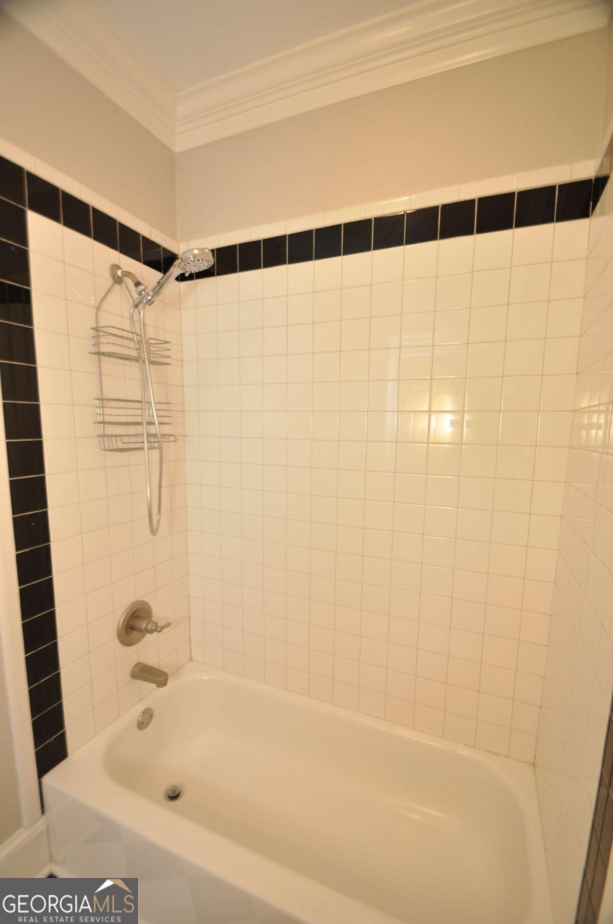 1070 Lexington Court Bishop, GA 30621 - Photo 41 of 67 a bathroom with a shower and a bathtub