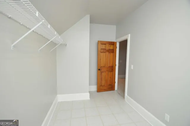 a view of a closet area with an entryway