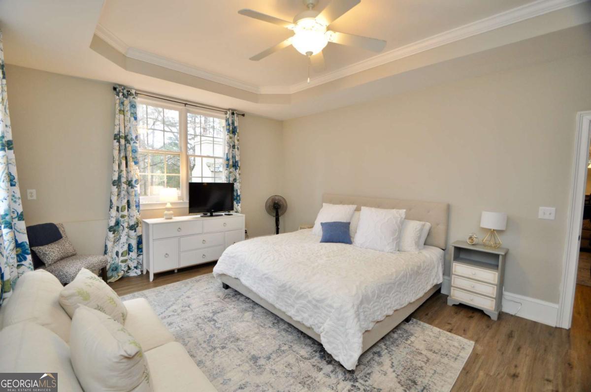 1070 Lexington Court Bishop, GA 30621 - Photo 53 of 67 a bedroom with a bed and a large window