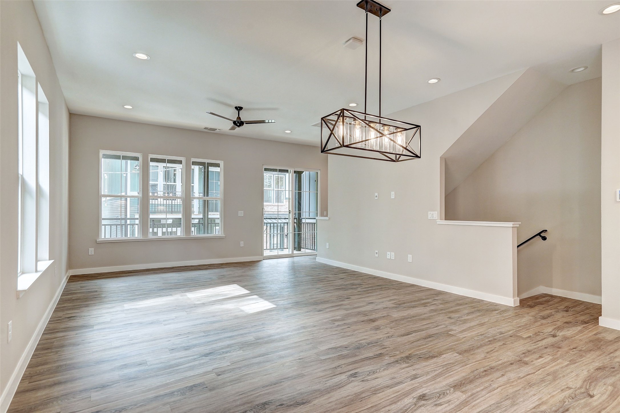 3809 Valley View Road, Unit 13 Austin, TX 78704 - Photo 9 of 27 a view of an empty room with wooden floor and a window