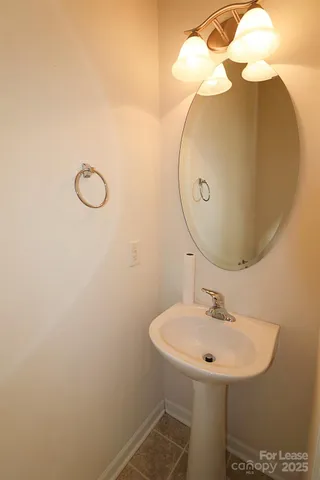 a bathroom with a sink and mirror