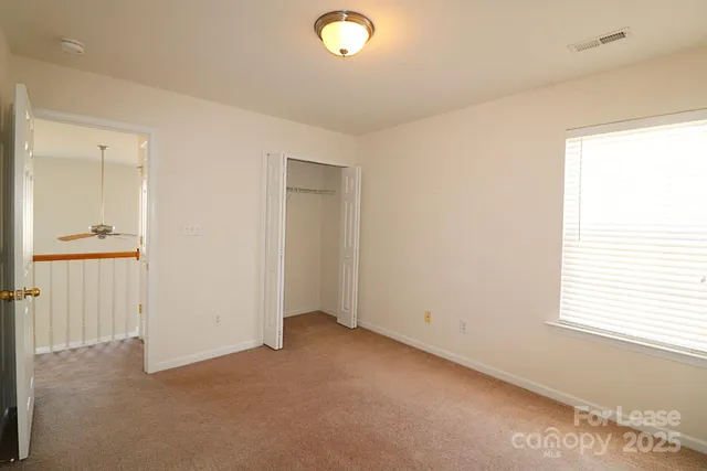 a bathroom with a sink mirror and a shower