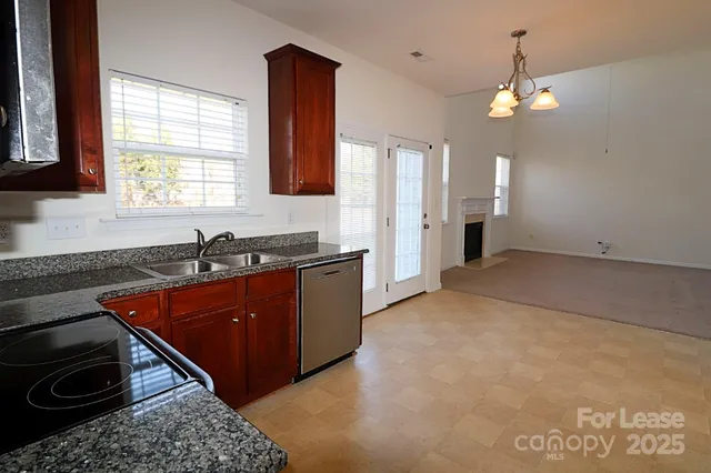 a kitchen that has a sink and a stove