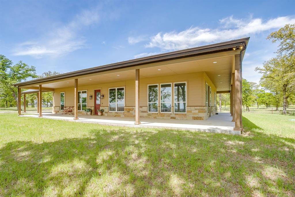 990 Doss Road Millsap, TX 76066 - Photo 38 of 39 a swimming pool with outdoor seating and yard