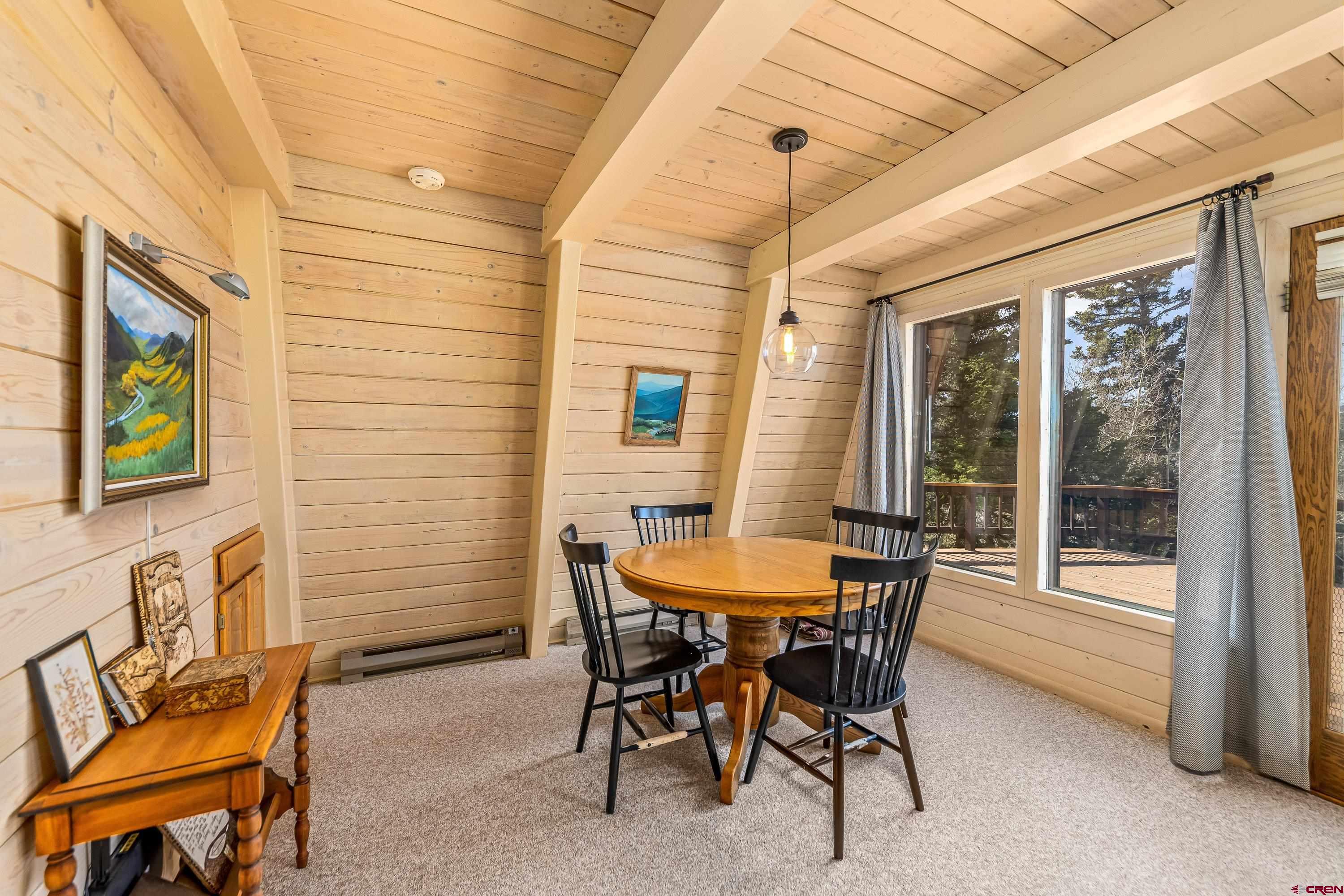 771 Spruce Road Cimarron, CO 81220 - Photo 13 of 34 a dining room with furniture and window