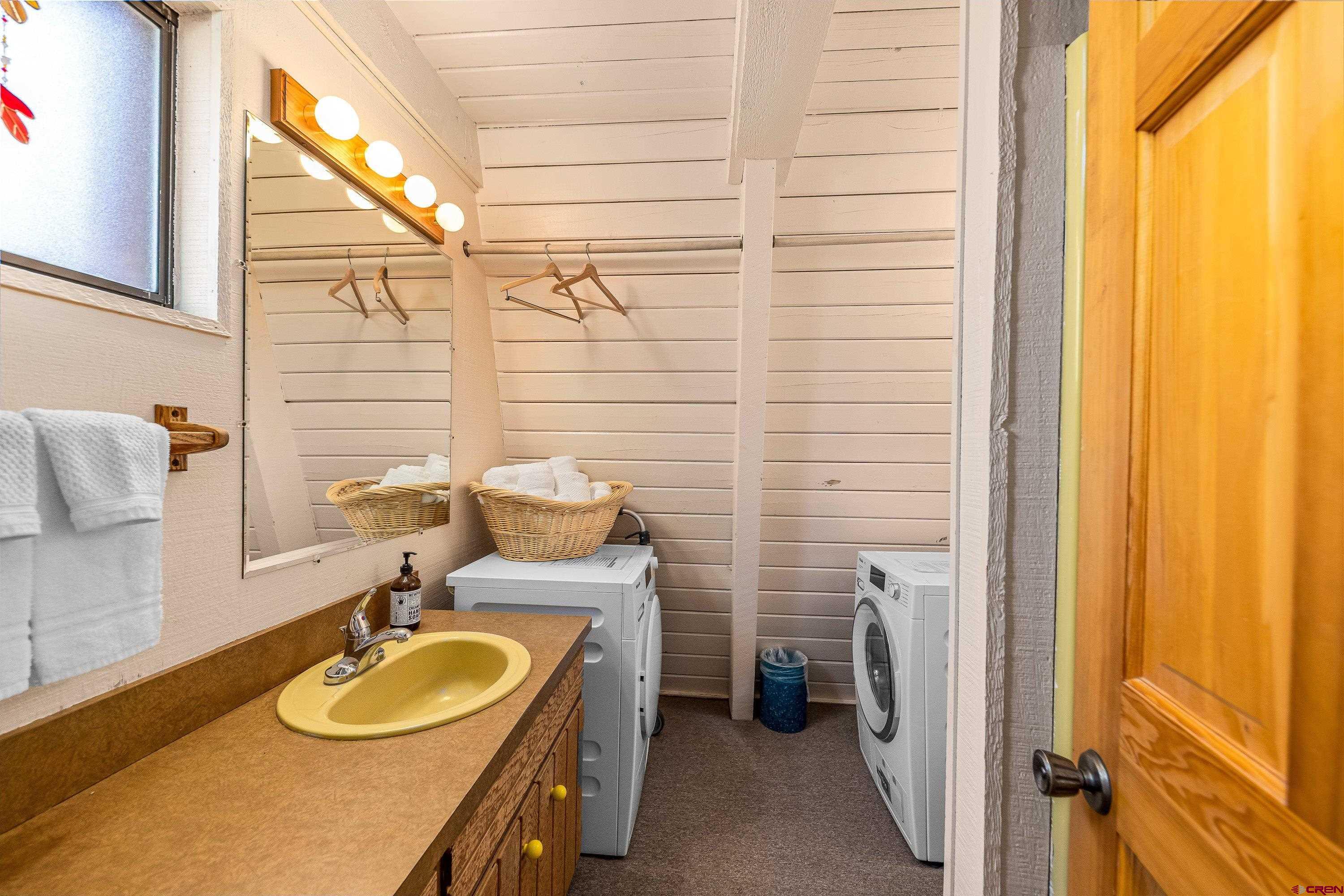 771 Spruce Road Cimarron, CO 81220 - Photo 8 of 34 a bathroom with a sink and a mirror