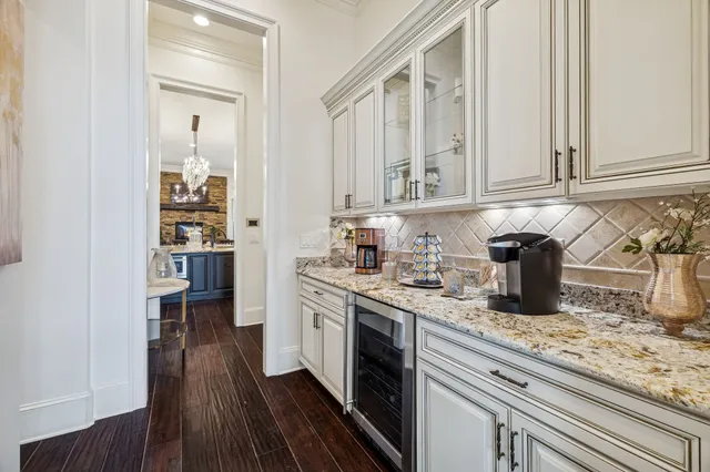 a front view of a house with sitting area