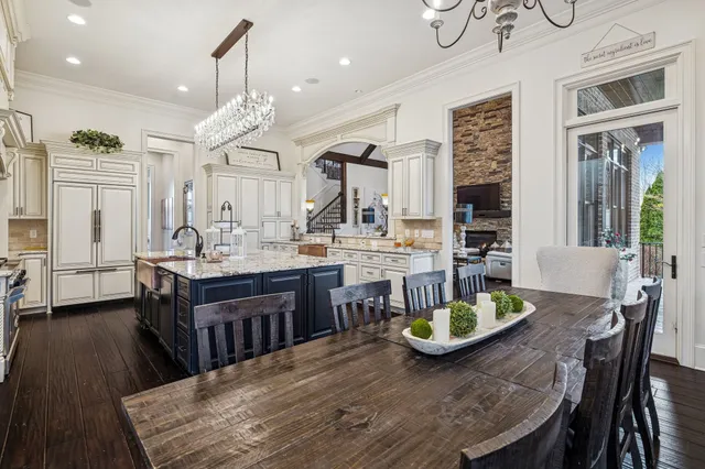 a view of a hallway with wooden floor and seating