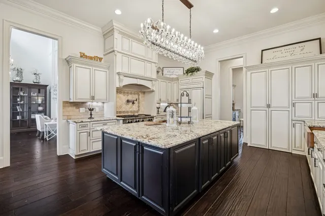 a bathroom with a granite countertop sink a toilet and a mirror