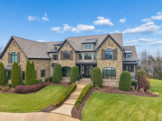 a view of a dining room with furniture wooden floor and chandelier