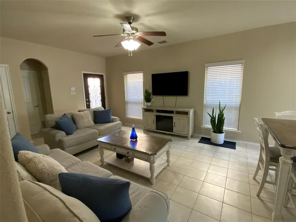 a kitchen with a sink a refrigerator a stove a microwave and island