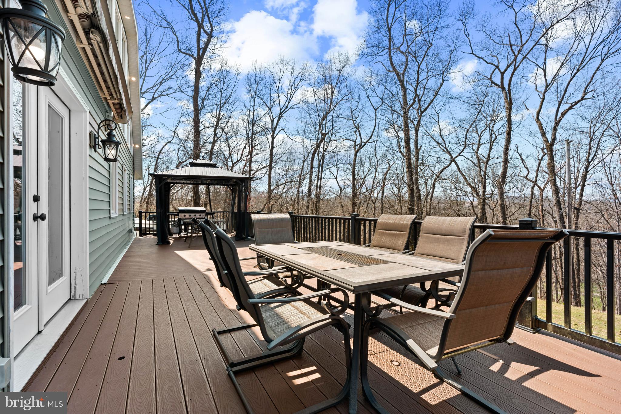 51 Hausman Road Lenhartsville, PA 19534 - Photo 22 of 64 a view of a roof deck with table and chairs and wooden floor