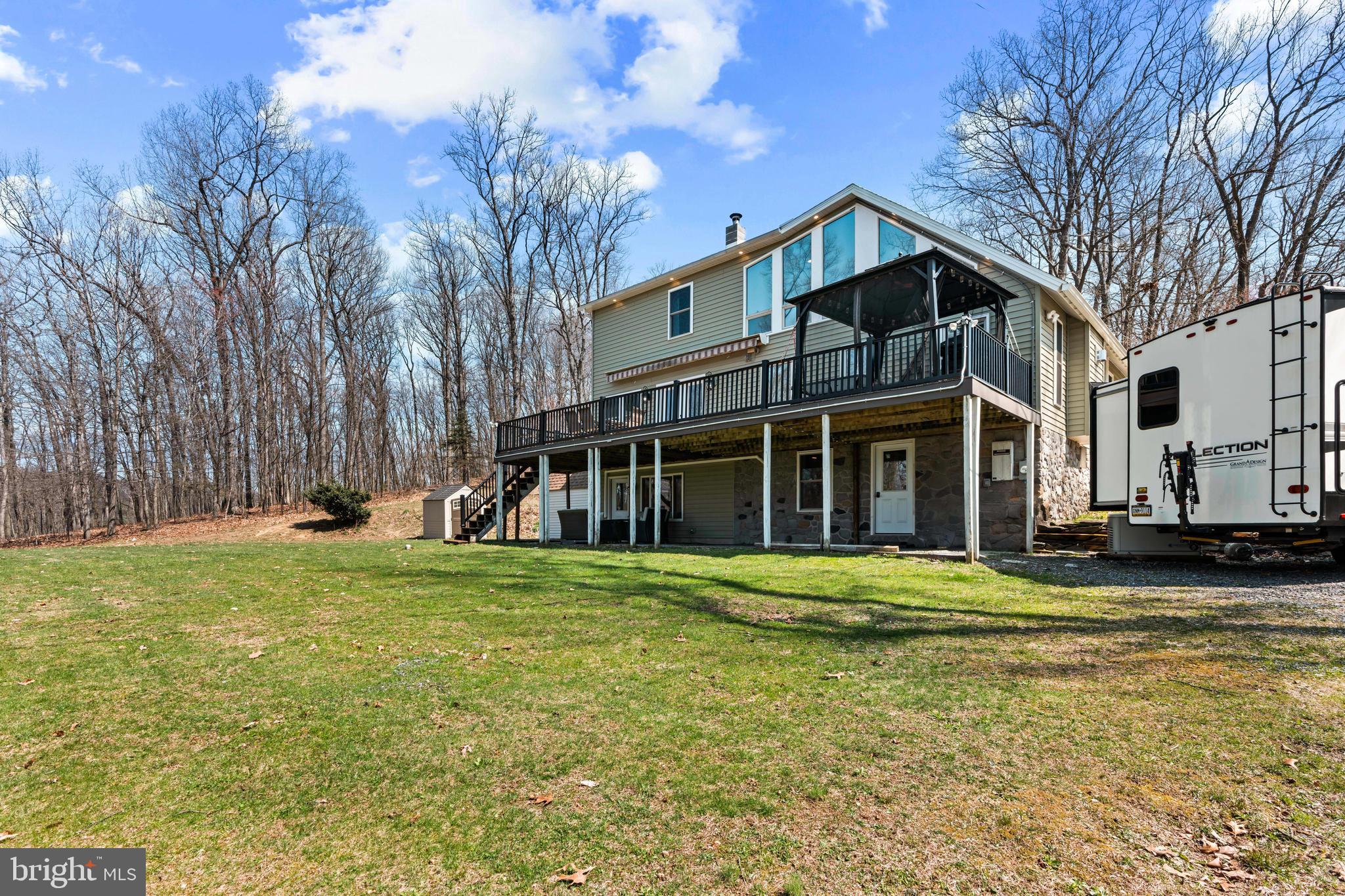 51 Hausman Road Lenhartsville, PA 19534 - Photo 26 of 64 a view of a house with a yard and large trees