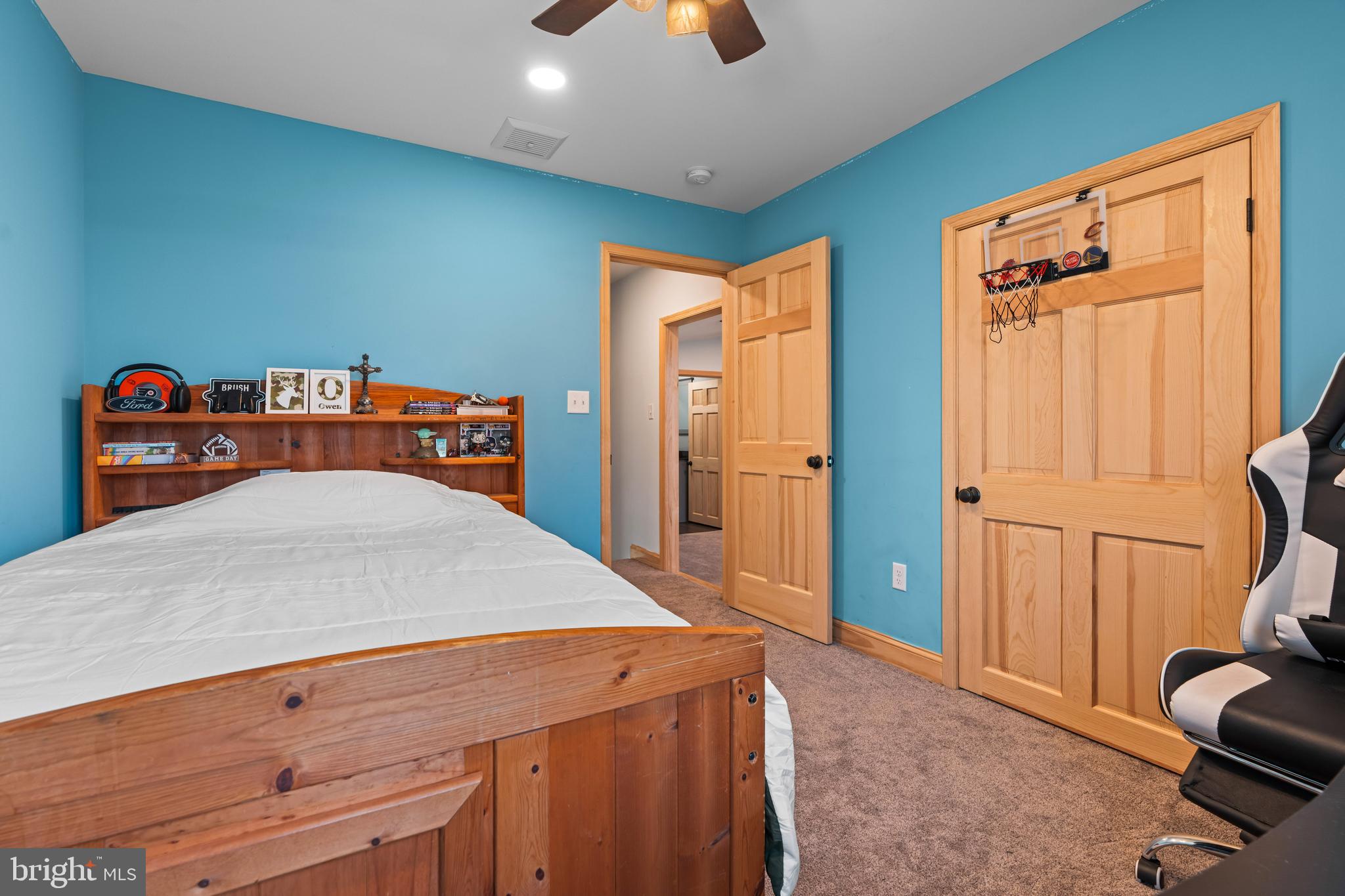 51 Hausman Road Lenhartsville, PA 19534 - Photo 29 of 64 a bedroom with a bed and a chandelier