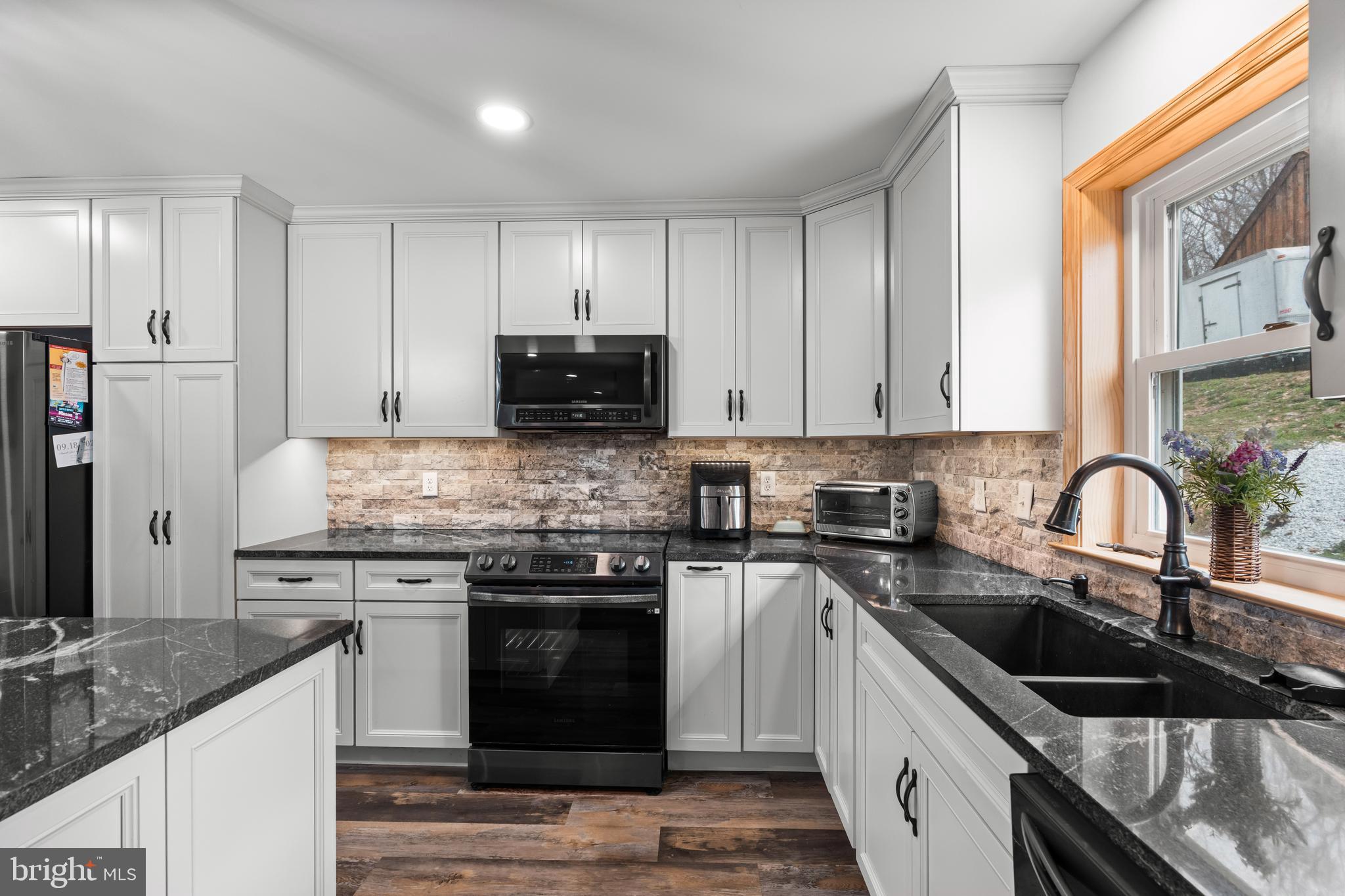 51 Hausman Road Lenhartsville, PA 19534 - Photo 4 of 64 a kitchen with stainless steel appliances granite countertop a sink stove and refrigerator