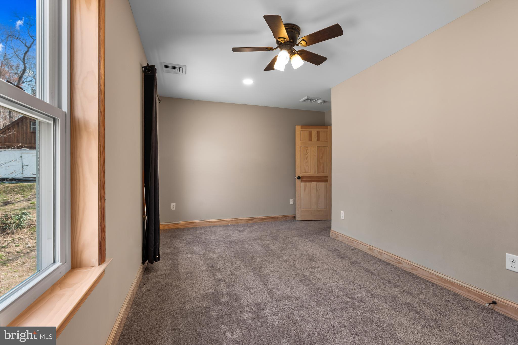 51 Hausman Road Lenhartsville, PA 19534 - Photo 43 of 64 an empty room with a empty space and a ceiling fan