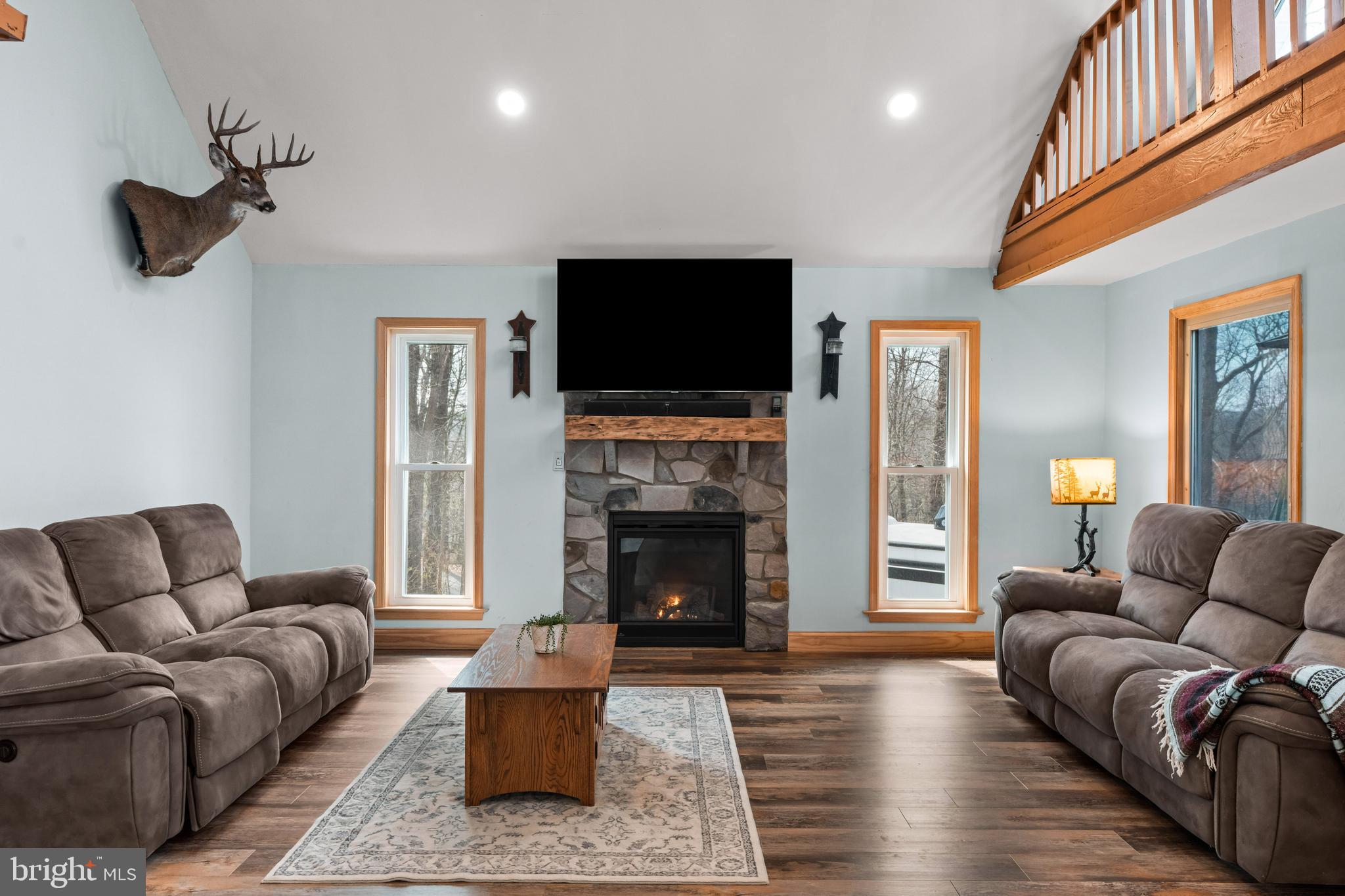 51 Hausman Road Lenhartsville, PA 19534 - Photo 57 of 64 a living room with furniture a flat screen tv and a fireplace