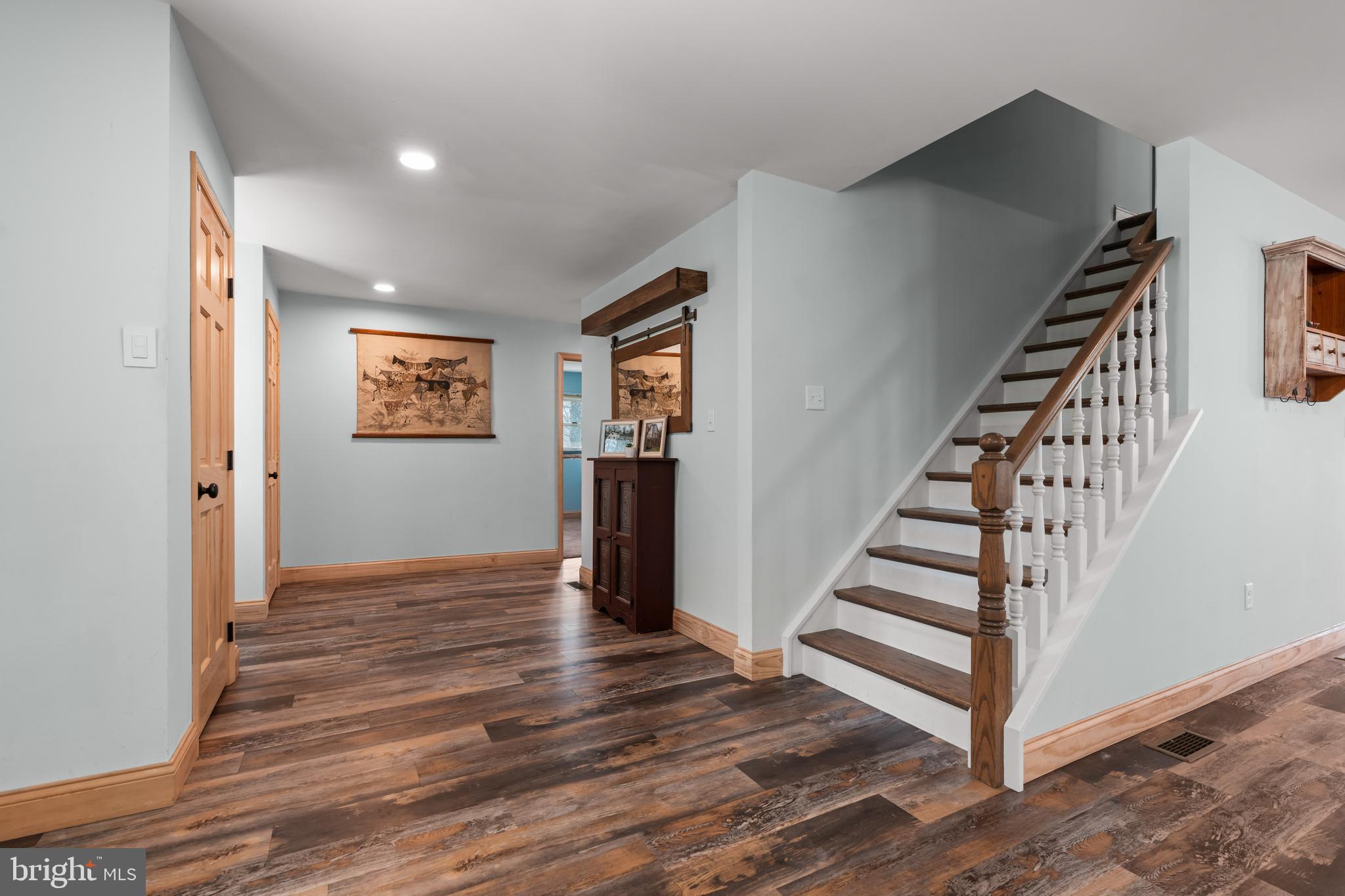 51 Hausman Road Lenhartsville, PA 19534 - Photo 59 of 64 a view of a hallway with wooden floor and stairs