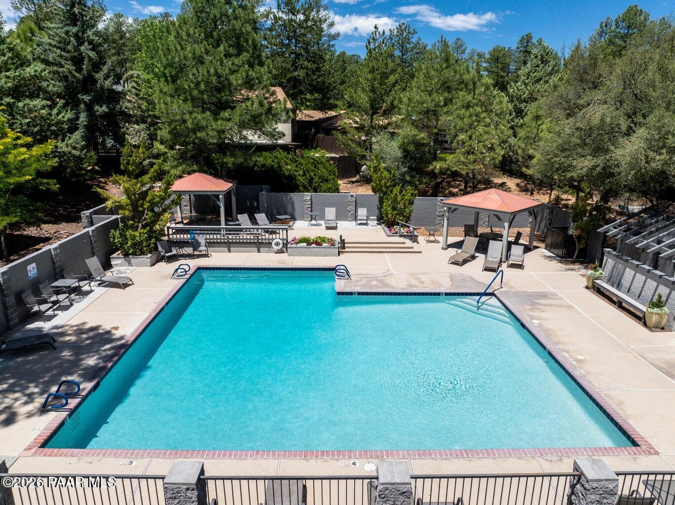 305 Ridge Court Prescott, AZ 86303 - Photo 33 of 35 a view of a patio with chairs and a table