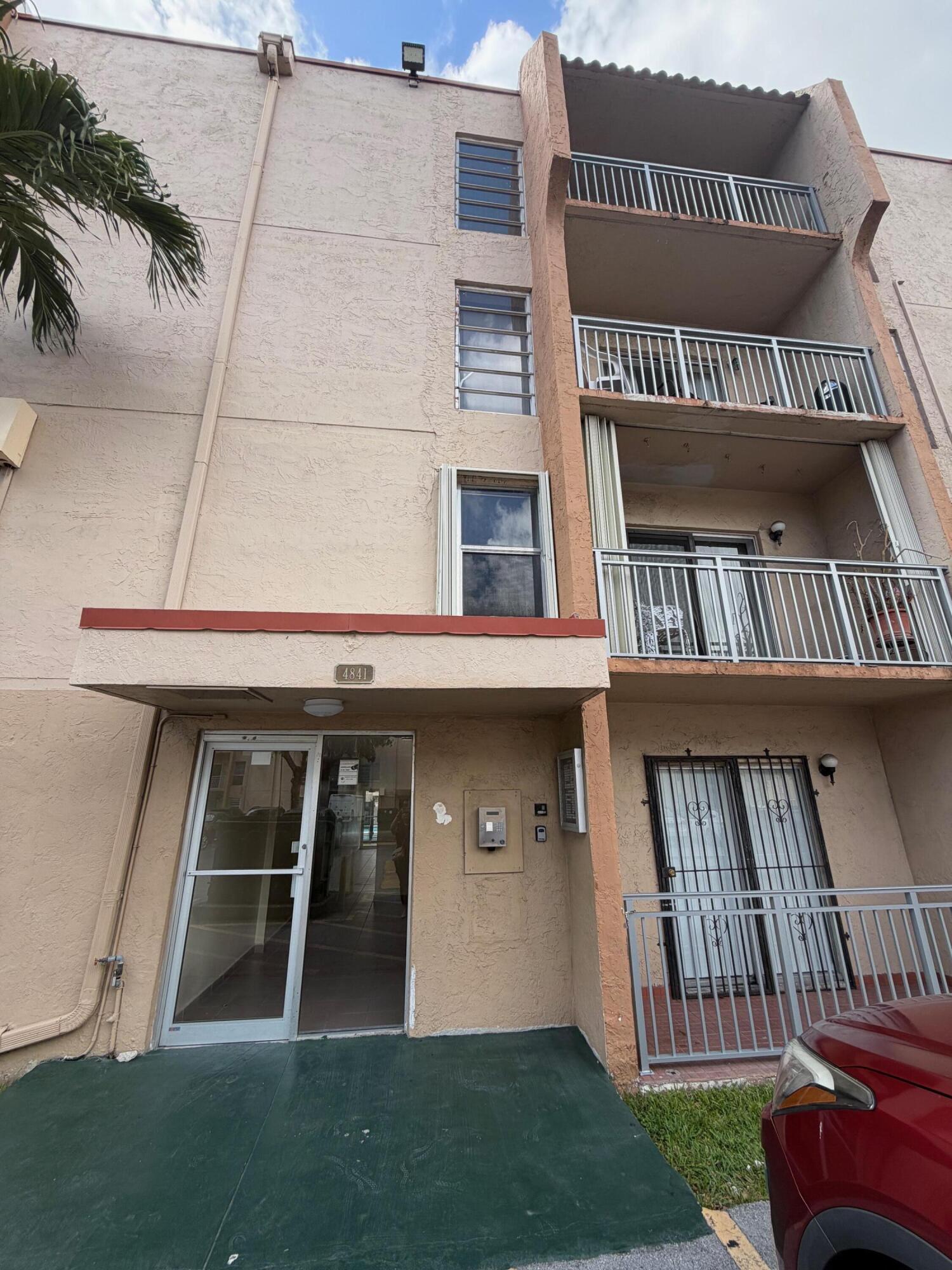 4841 Northwest 7th Street, Unit 3084 Miami, FL 33126 - Photo 11 of 29 a view of front door of house