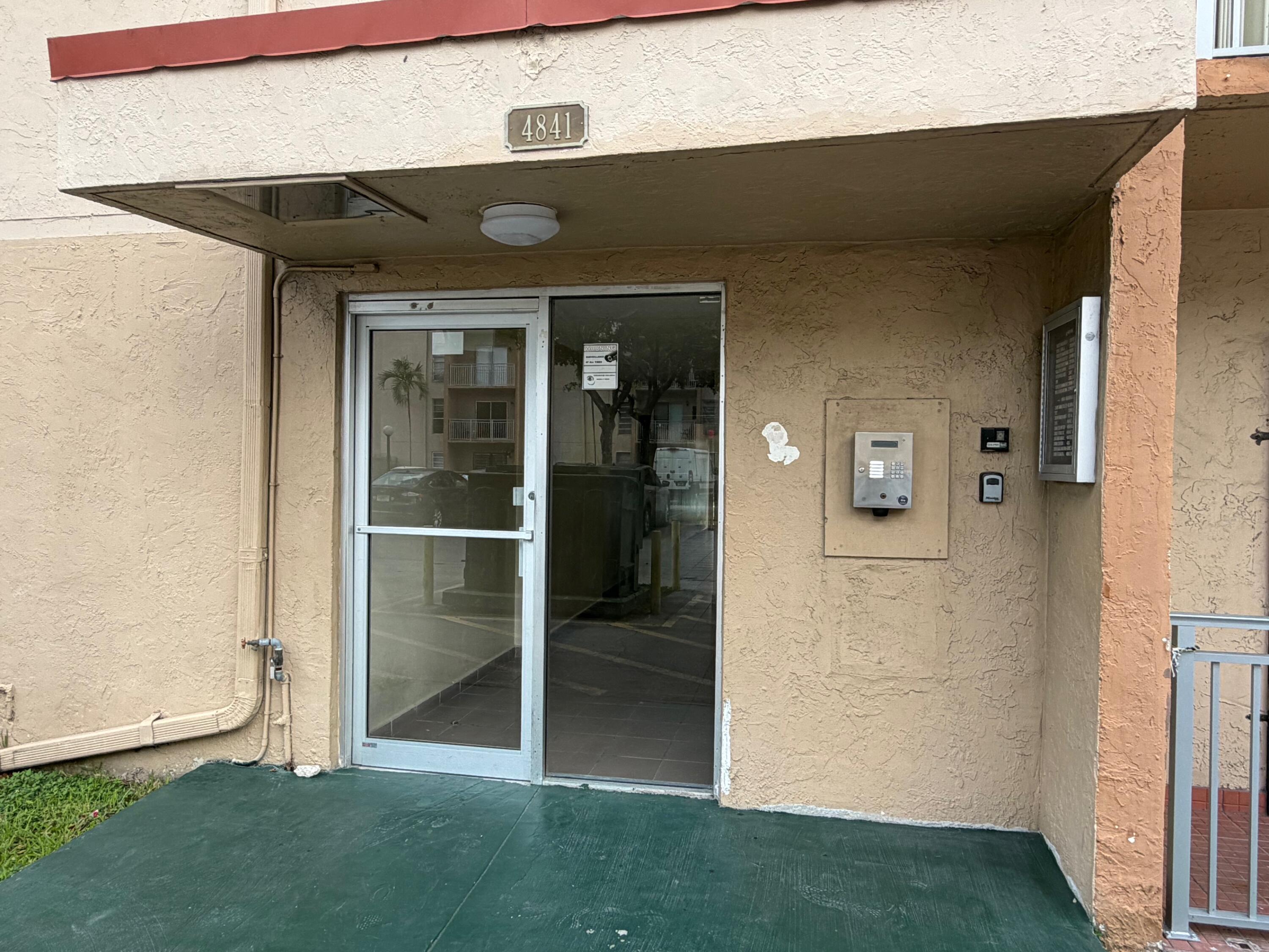 4841 Northwest 7th Street, Unit 3084 Miami, FL 33126 - Photo 12 of 29 a view of front door of house