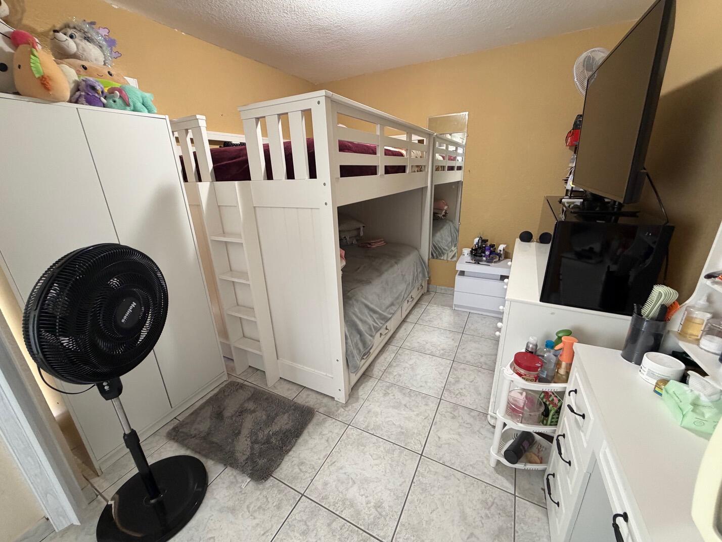 4841 Northwest 7th Street, Unit 3084 Miami, FL 33126 - Photo 24 of 29 a hallway with a washer and dryer