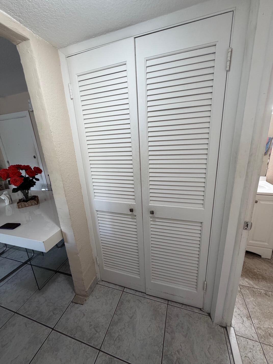 4841 Northwest 7th Street, Unit 3084 Miami, FL 33126 - Photo 25 of 29 a view of a hallway to rooms and a window