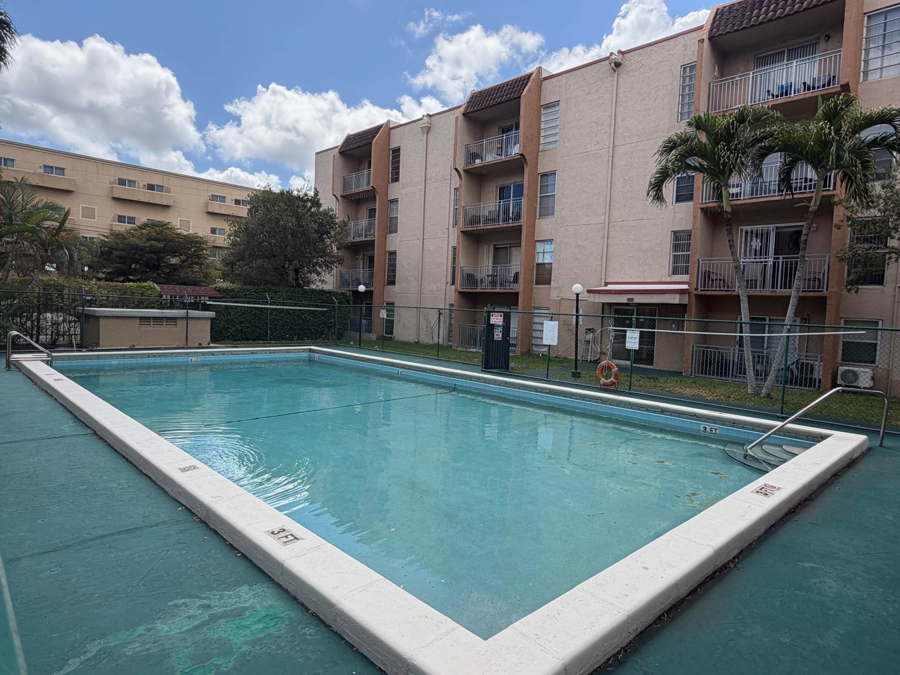 4841 Northwest 7th Street, Unit 3084 Miami, FL 33126 - Photo 26 of 29 a view of swimming pool with a yard